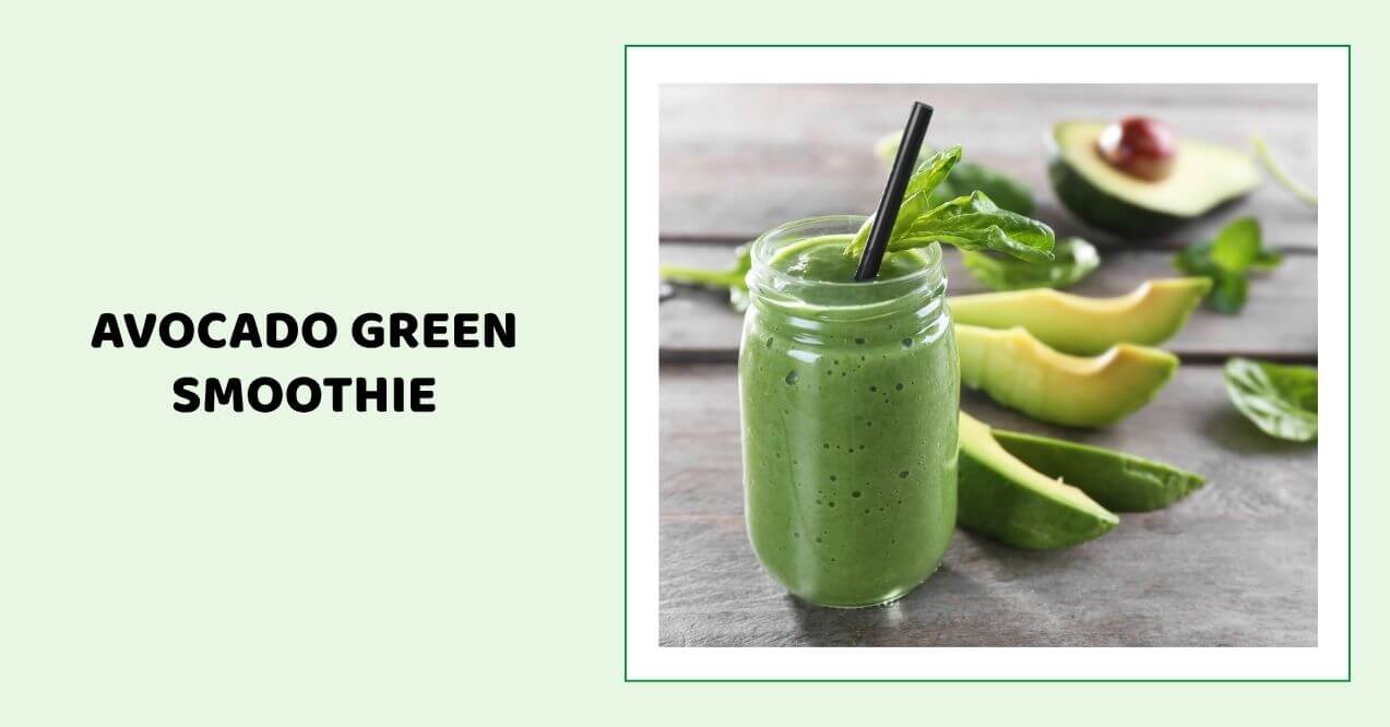 Glass of avocado green smoothie with spinach and avocado slices