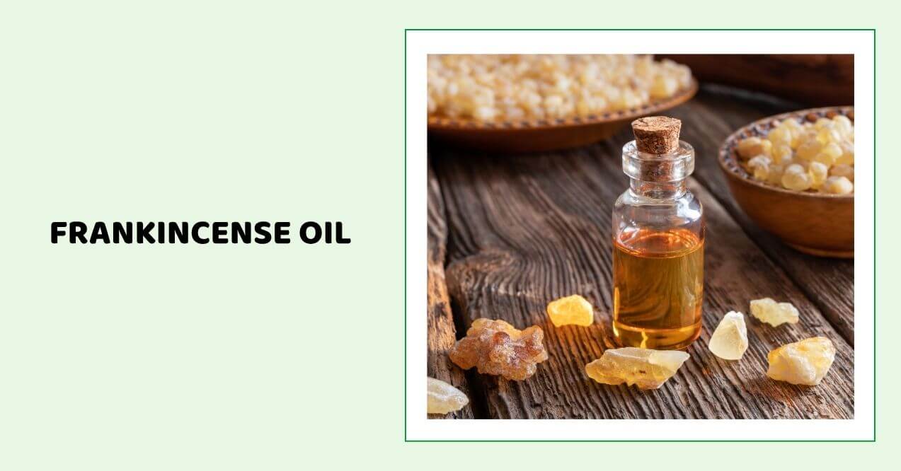 Frankincense oil bottle with resin pieces and wooden bowl